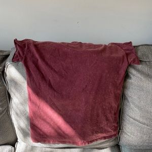 Maroon T shirt.